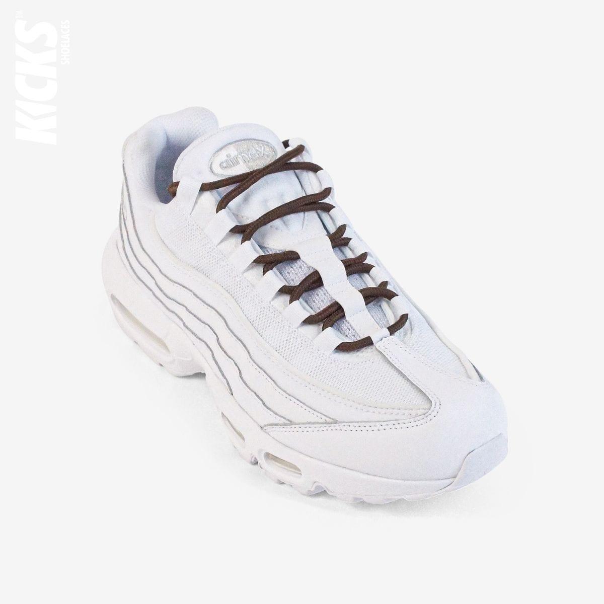 Brown round shoestrings on white sneakers by Kicks Shoelaces
