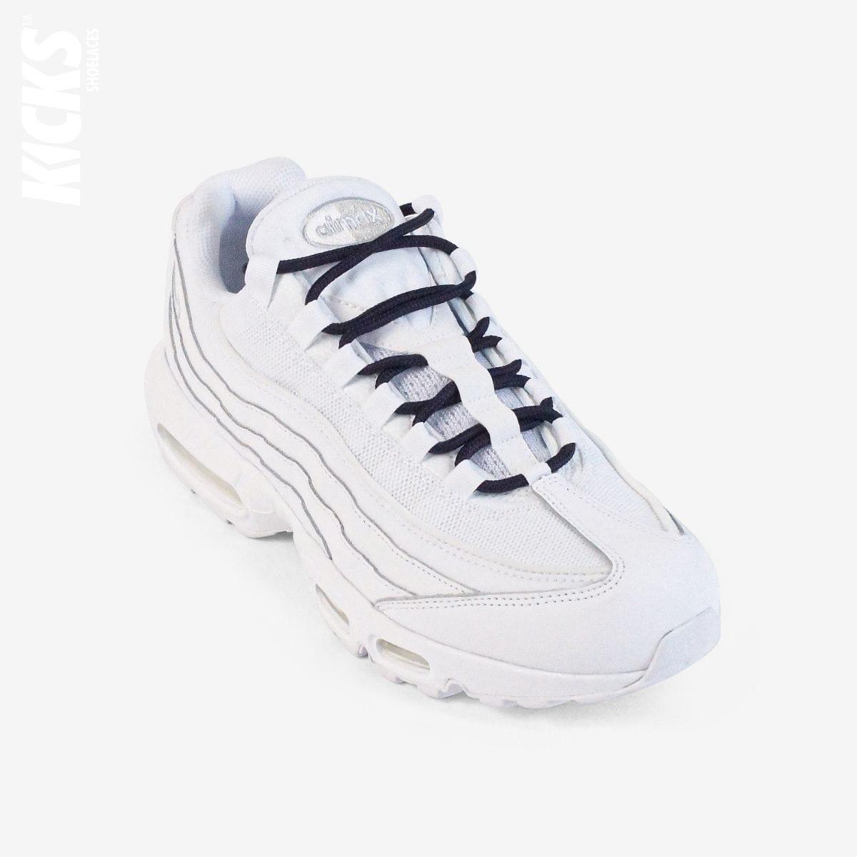 Dark blue round shoestrings on white sneakers by Kicks Shoelaces