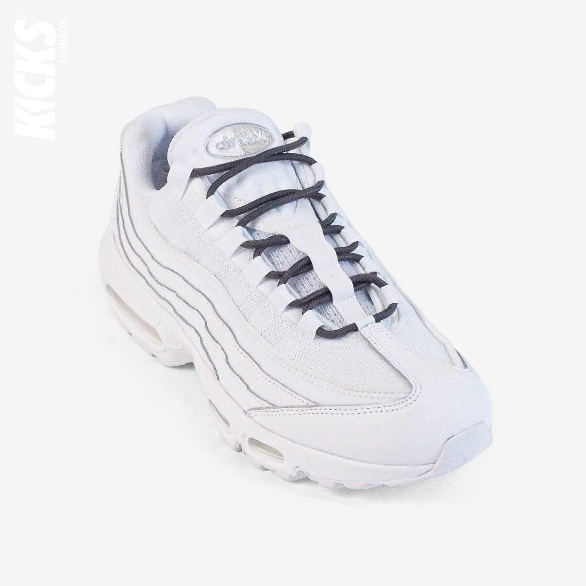 Dark grey round shoestrings on white sneakers by Kicks Shoelaces