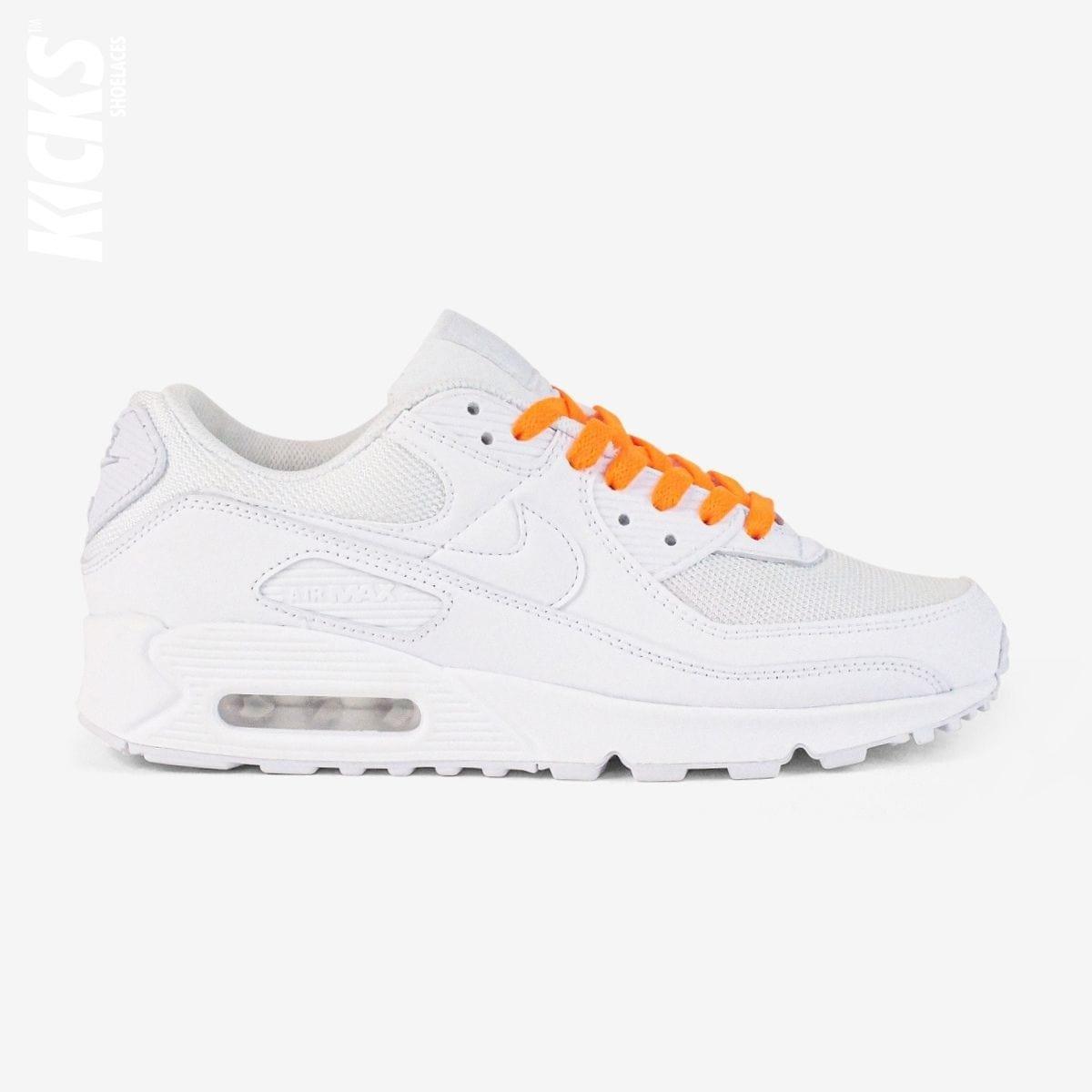 Orange shoelaces on white lifestyle sneakers, a stylish lace upgrade for everyday shoes by Kicks Shoelaces