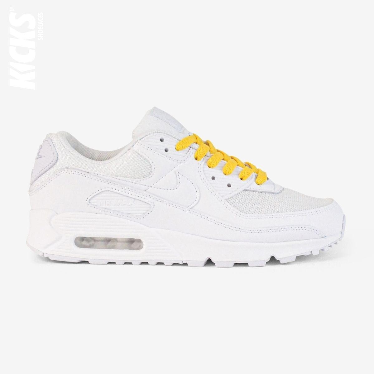 Golden yellow shoelaces on white lifestyle sneakers, a stylish lace upgrade for everyday shoes by Kicks Shoelaces