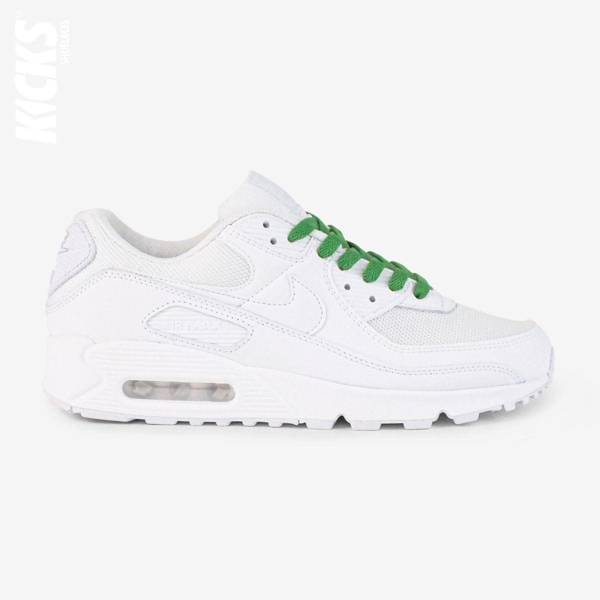 Green shoelaces on white lifestyle sneakers, a stylish lace upgrade for everyday shoes by Kicks Shoelaces