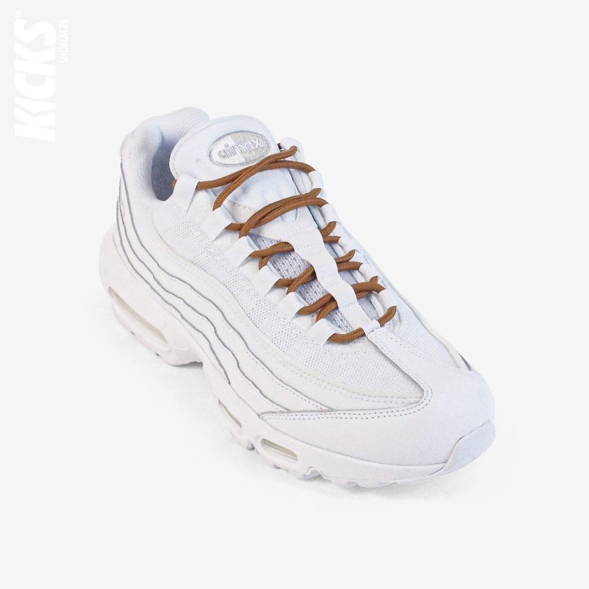 Golden brown round shoestrings on white sneakers by Kicks Shoelaces