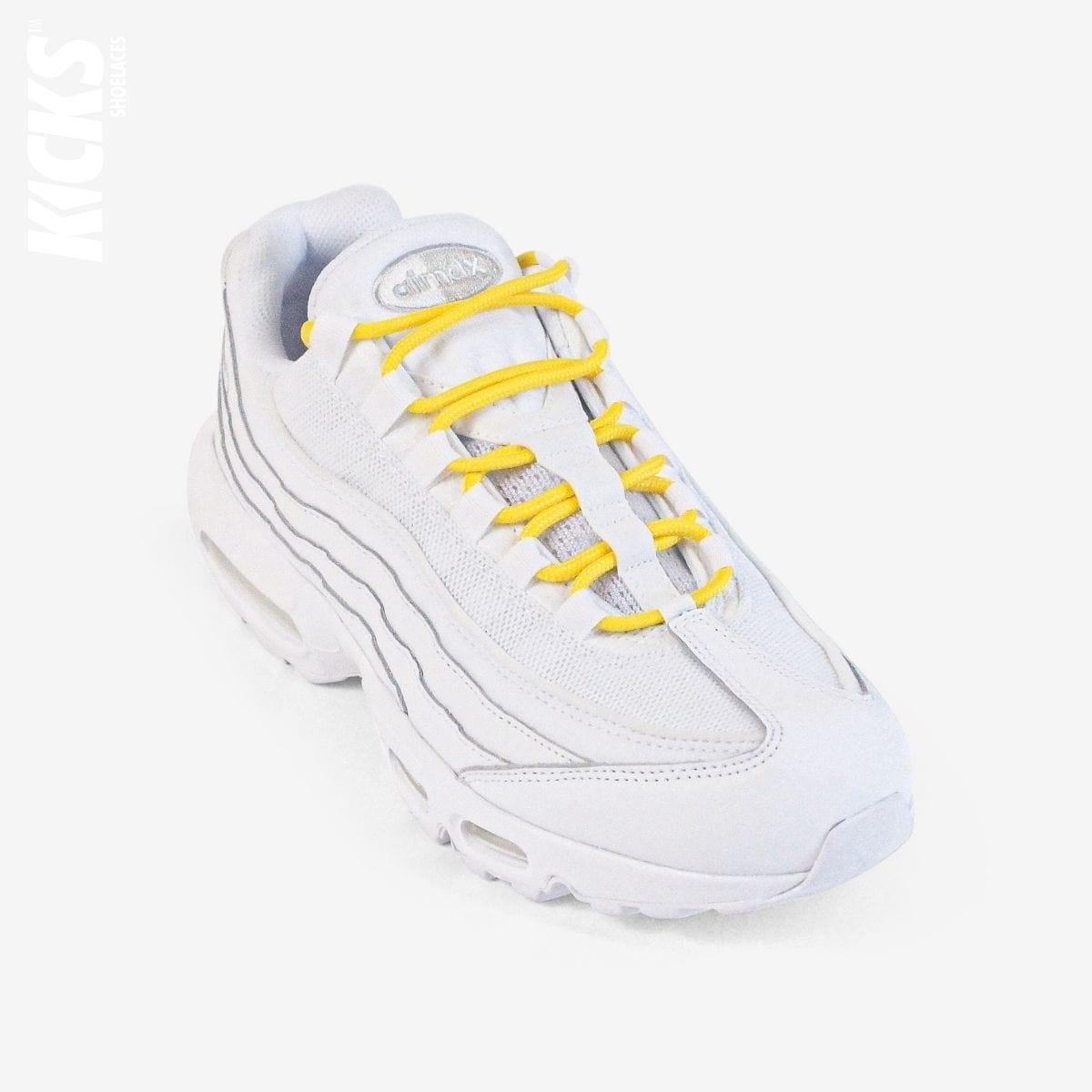Golden yellow round shoestrings on white sneakers by Kicks Shoelaces