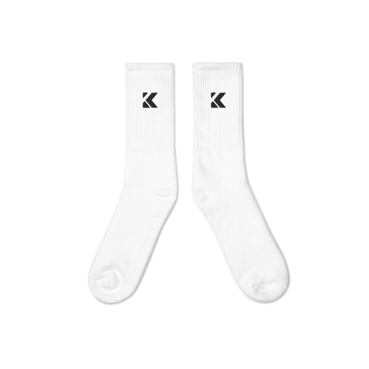 Two white socks with a Kicks black logo on a white background
