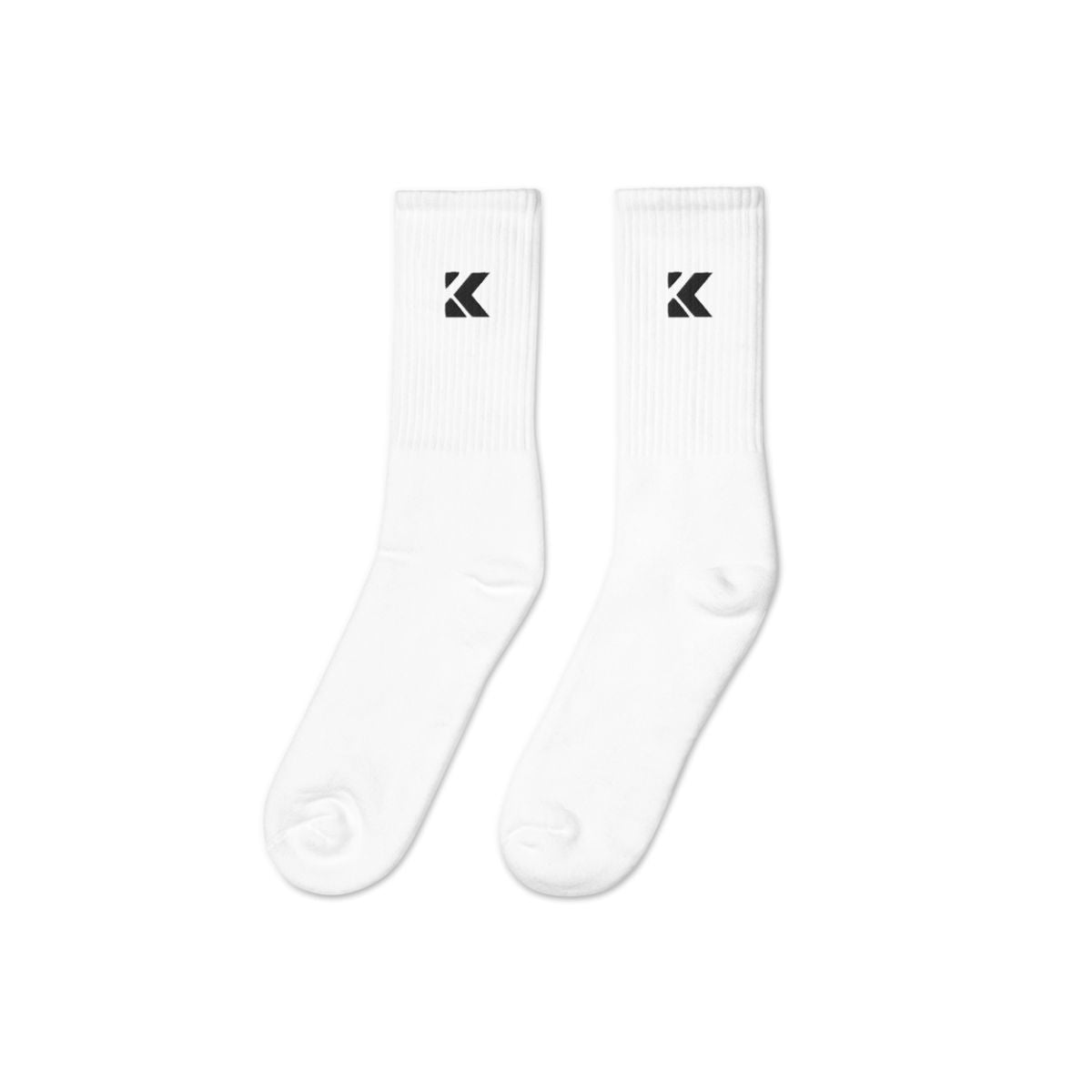 Two white socks with Kicks logo on a white background