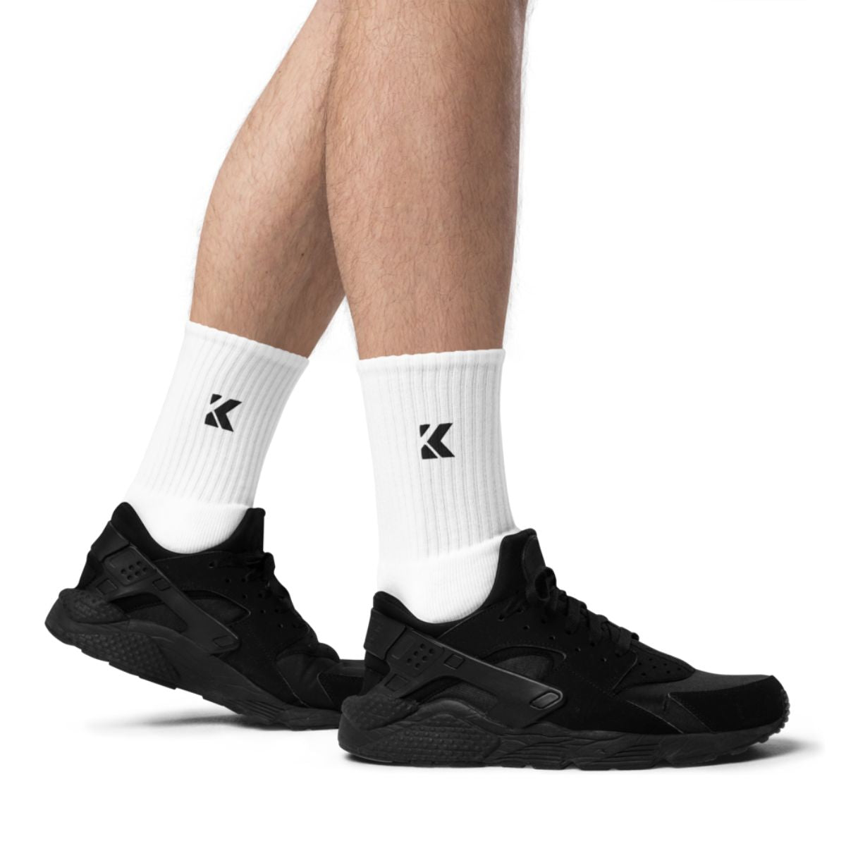 Black athletic shoes and white socks