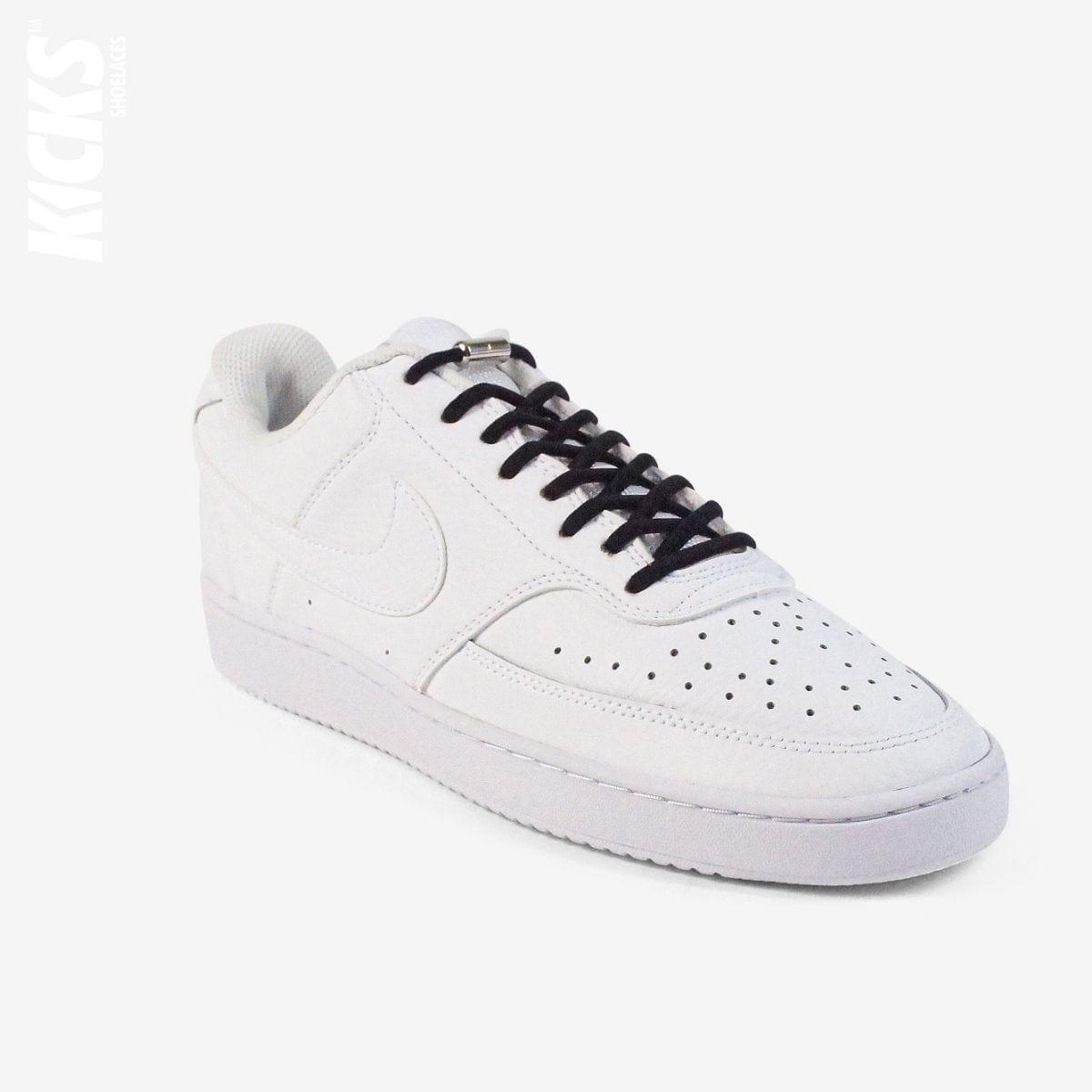 Black oval no-tie elastic shoelaces installed on white sneakers by Kicks Shoelaces