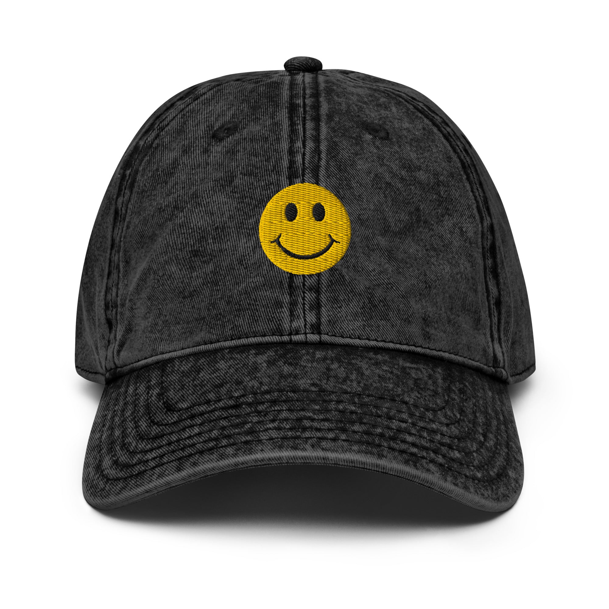 Black smiley face embroidered baseball cap with adjustable fit, washed-out design for everyday wear and street style.