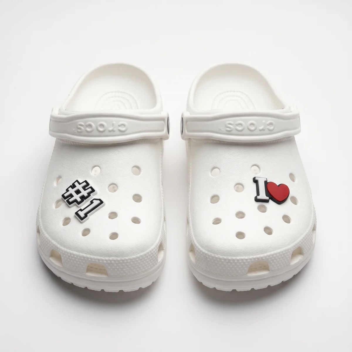 Crocs with varsity number charms by Kicks Shoelaces.