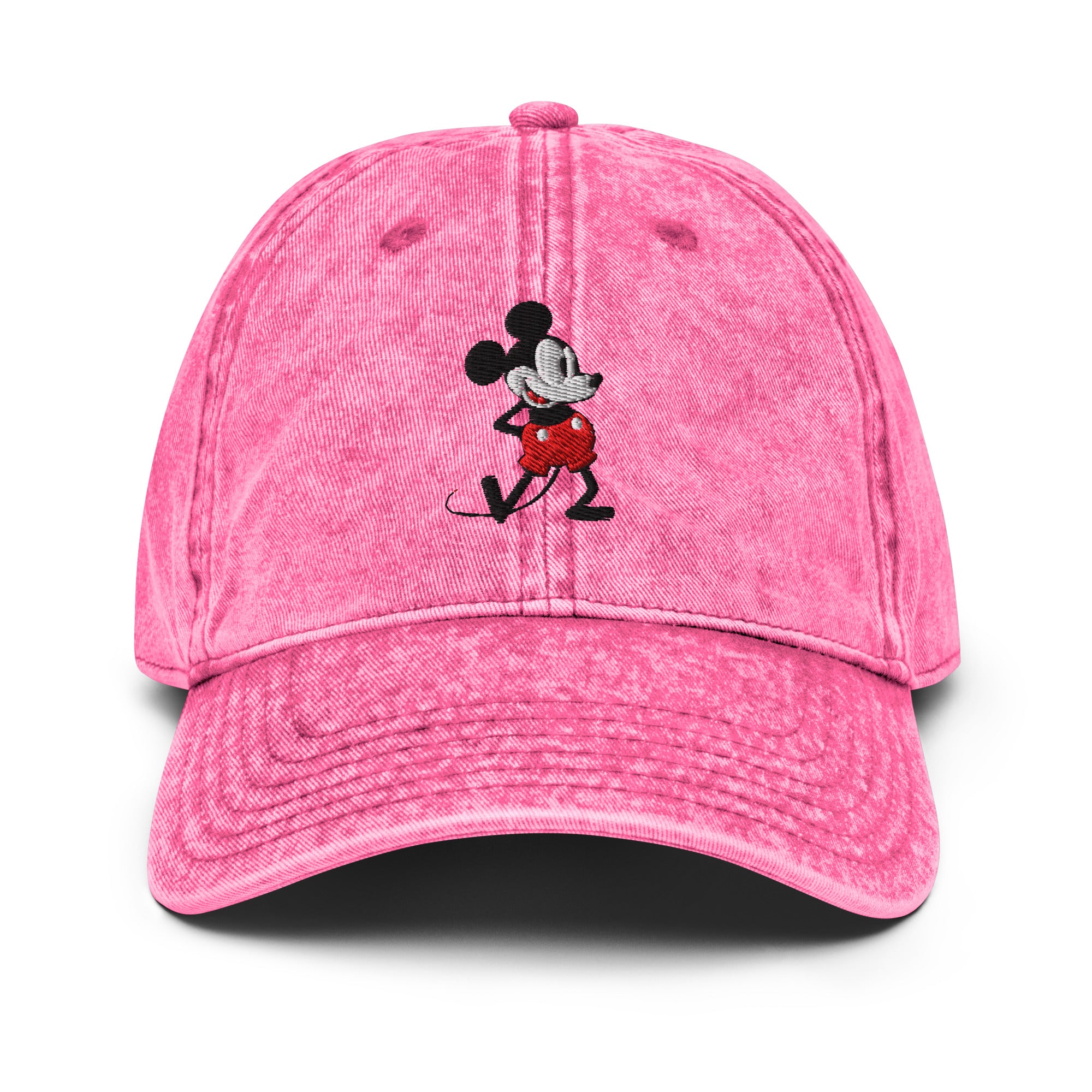 Pink baseball cap with a 1928 Mickey Mouse steamboat willie cartoon character embroidered on it.