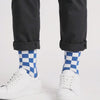 Video showing the Kicks Checkered Crew Socks 3-Pack in blue and white, red and white, and black and white colourways worn with white sneakers in a studio.